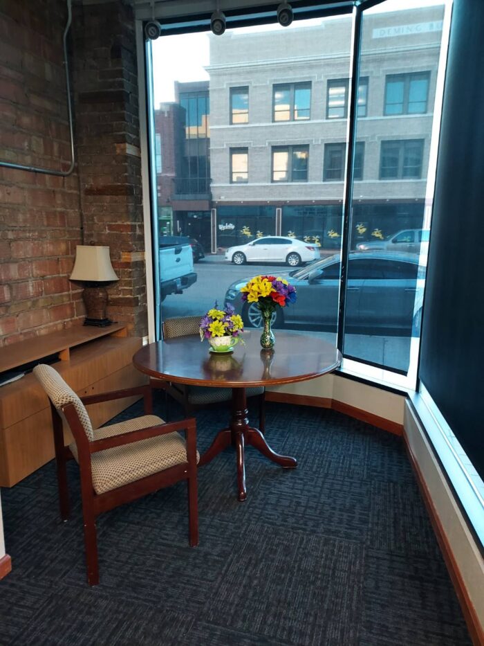 An office space looking out on downtown Cheyenne, WY that's part of 17th and Central Executive Suites.