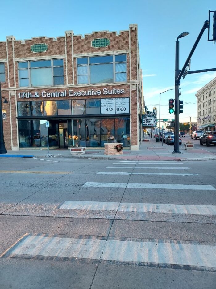 A green light and crosswalk leading to the exterior of Wyoming Registered Agent in Cheyenne, WY.