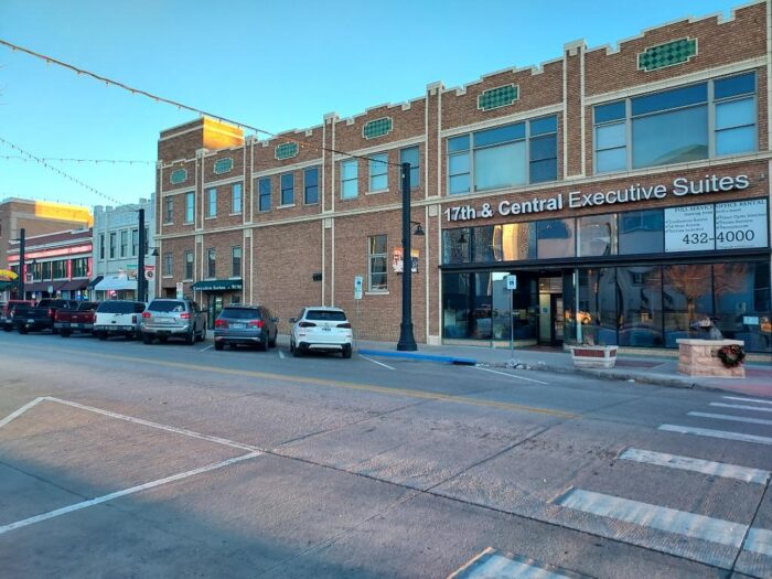 A row of buildings in downtown Cheyenne, WY, including the exterior of Wyoming Registered Agent.